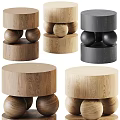 Modern Wooden Stools With Round Seats And Decorative Balls In Natural And Dark Tones