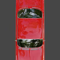 Classic Red Sedan Car With Chrome Accents And Vintage Body Design