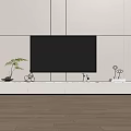 Modern TV Stand With Black TV Potted Plant Decorative Items And Wooden Floor