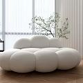 Cloud Shaped Irregular Sofa in Modern Room with Wooden Floor White Curtains and Green Plant