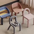 Colorful Children's Chairs Featuring Loop Design And Soft Upholstery On Carpet Floor