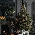 Classic Christmas Living Room With Decorated Fireplace Lit Tree Gifts Sofa And Bookshelf