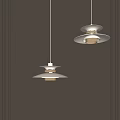 Modern Pendant Lights With Layered Design And Warm Glow Hanging Against Gray Wall
