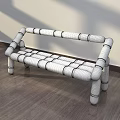 Navy Blue Public Bench With Orange Stripes And Tubular Structure On Wooden Floor Against Wall
