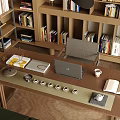 Home Office Supplies On Wooden Desk With Laptop Open Book Coffee Cup And Bookshelves