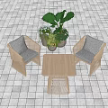 Two Woven Leisure Chairs With Square Wooden Table And Green Plants On Tile Floor