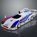 White Racing Car Model With Blue Red Stripes Number 4 And Shell Logo