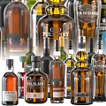 Assorted Wine Bottles And Wine Glasses Collection With Various Brands And Colorful Designs