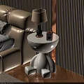 White Round Side Table with Distinctive Legs Next to Beige Sofa Holding Lamp and Radio