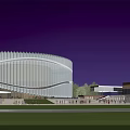 Modern Cultural Center Building With Illuminated Glass Facade And Outdoor Plaza At Night