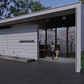 Modern Entrance Gate With Covered Structure And Green Plants Near High Rise Building