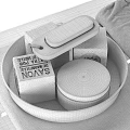 Minimalist Bathroom Accessories with White Tray Soap Black Container and Gray Towel on Wooden Surface