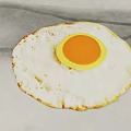Perfectly Cooked Fried Egg With Golden White Crispy Edges And Orange Yolk