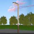 Outdoor Street Light With Blue Sky Pink Clouds Green Trees And Paved Ground