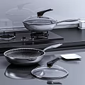 Stainless Steel Kitchen Cookware Set With Frying Pans Spatula And Glass Lid On Stove Top