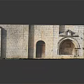 Ancient Stone Building With Arched Doorways And Weathered Stone Wall Details