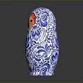 Traditional Matryoshka Doll With Blue White Floral Patterns And Red Hair
