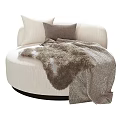 Round Beige Single Sofa with Soft Pillows and Furry Striped Blanket for Cozy Living Space