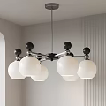 Modern Chandelier with White Globe Shades and Black Spherical Accents for Contemporary Interior Lighting