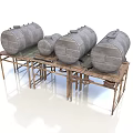 Large And Small Industrial Metal Storage Tanks Placed On Rustic Metal Stands
