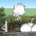Lush Green Garden Landscape With White Building And Trees Under Blue Sky With Clouds
