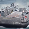 Hovercraft Warship Sailing On Sea With Large Fans And Inflatable Skirt Creating Water Splashes