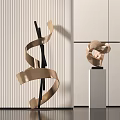 Abstract Golden Ribbon Sculpture With Twisted Curved Design In Modern Interior With Striped Wall Pedestal