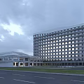Modern Multi Storey Hospital Building With Glass Facade And Roadside Green Lawn