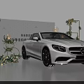 White Mercedes Car Display With Green Plant Decorations Frames And Lanterns