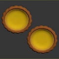 Two Fresh Baked Egg Tarts With Golden Yellow Filling And Orange Fluted Crust