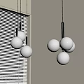 Multiple White Spherical Chandeliers with Black Rods in Interior Near Window