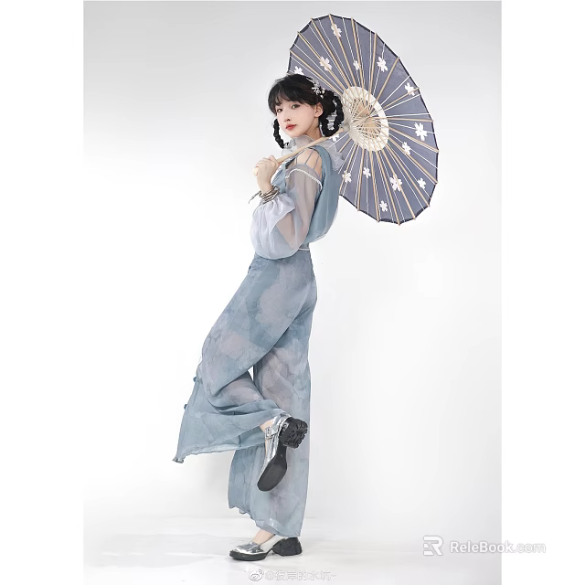 Woman in Light Blue Traditional Clothing Holding Star Patterned Umbrella Against White Background 3d model 