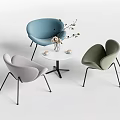 Modern Table and Chair Set with Blue Gray Green Chairs Black Legs and Vase Flowers