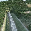 Road Infrastructure With Tunnel And Highway Passing Through Lush Mountain Vegetation