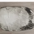 Oval Stylish Rug With Gray And White Abstract Pattern On Wooden Floor