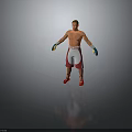 Shirtless Male Boxer Standing in Red White Shorts Red Shoes and Blue Yellow Gloves