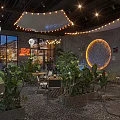 JOHOBUS Bar Restaurant Interior With Lush Plants Circular Decoration Lighting And Pebble Floor