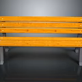 Wooden Bench With Yellow Slats And Metal Support Legs For Outdoor Use