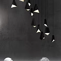Modern Interior With Stylish Pendant Lights Gray Walls And Decorative Spheres