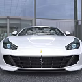 White Ferrari Sports Car With Transparent Roof Sleek Design And Black Alloy Wheels