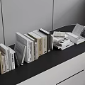 Books and Magazines Display on Black Countertop Neatly Arranged with Open and Stacked Books