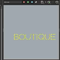 Green Neon Decorative Light With BOUTIQUE Text On Dark Blue Background