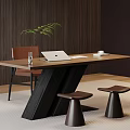 Modern Wooden Desk With Laptop Plant Cup And Chair Two Stools And Wooden Wall Background
