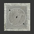 Square Manhole Cover With Stone Border And Detailed Circular Patterned Urban Design