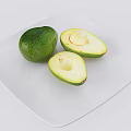 Fresh Green Avocado Whole and Halved with Pit on White Plate