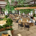 Open Space Restaurant With Wooden Ceiling Hanging Green Plants Pendant Lights And Red Brick Walls