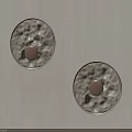 Two Circular Wall Sconces with Textured Design and Warm Light on Light Colored Wall 3d model