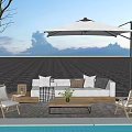 Outdoor Sofa With Cozy Pillows And Wooden Chairs Under Patio Umbrella By Pool