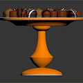 Assorted Chocolate Candies on Golden Pedestal Stand with Striped and Round Toppings