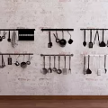Organized Kitchen Cookware Hanging On Wall Racks With Pots Pans Spoons And Spatulas